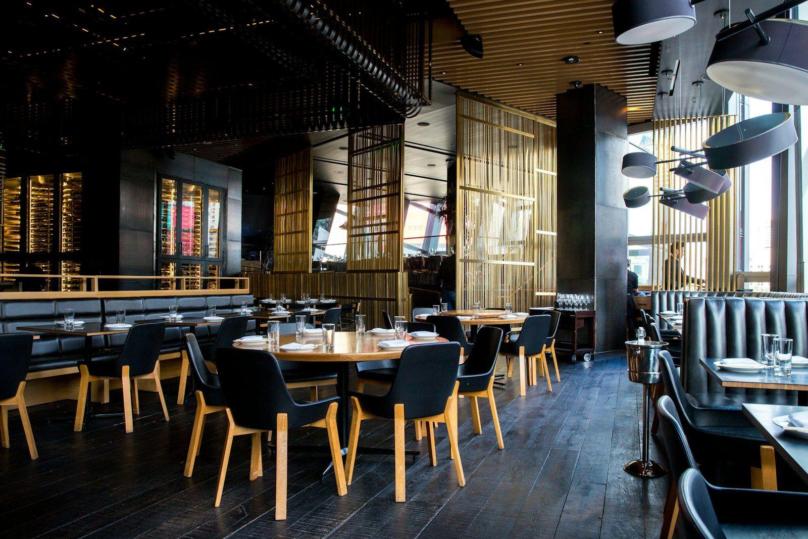 The Pacific Zen dining room, timber and stone, looking towards the ocean